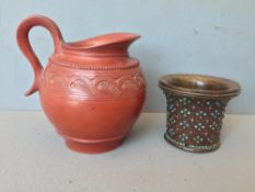 A 19th century Turkish Tophane terracotta jug
With loop handle and stylised leaf incised band;