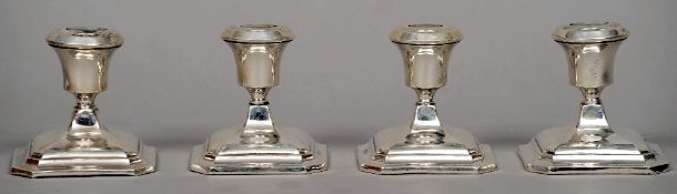 A set of four George V silver dwarf candlesticks, hallmarked Birmingham 1930, maker's mark