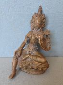 An 18th/19th century Tibetan bronze deity
Modelled seated on a lotus carved plinth.  10 cms high.