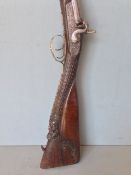 A 19th century Belgian double barrel shot gun
Inscribed Joseph Vivario Leage, the stock with