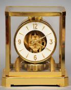 A lacquered brass cased LeCoultre Atmos clock
Of typical form, the white dial with Arabic numerals