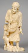 A 19th century Japanese ivory okimono
Formed as a fisherman and his son, carrying a basket of