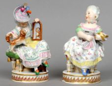 A pair of 19th century Meissen style Vienna porcelain figures
Modelled as seated ladies, one showing