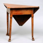 An 18th century yewwood drop leaf table, possibly Irish
The hinged top of canted triangular form