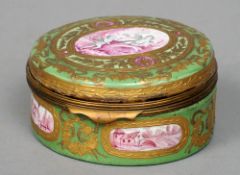 A late 18th/early 19th century enamel box
The hinged circular lid centred with a cherub filled