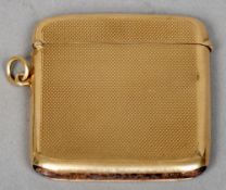 A 9 ct gold vesta case
With engine turned decoration marked for Asprey, London.  5 cms high.