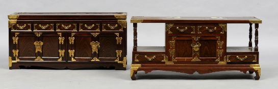 Two Chinese hardwood low side cabinets
Each with various arrangement of drawers and cupboard doors