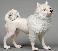 A 19th century Meissen porcelain dog, possibly a lion cut Pomeranian
Blue painted crossed swords