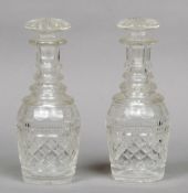 A pair of small 19th century cut glass decanters
Each with facet and hobnail cut decoration.  Each