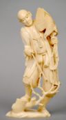 A Japanese carved ivory okimono
Formed as a gentleman holding a bird of prey, the underside signed.