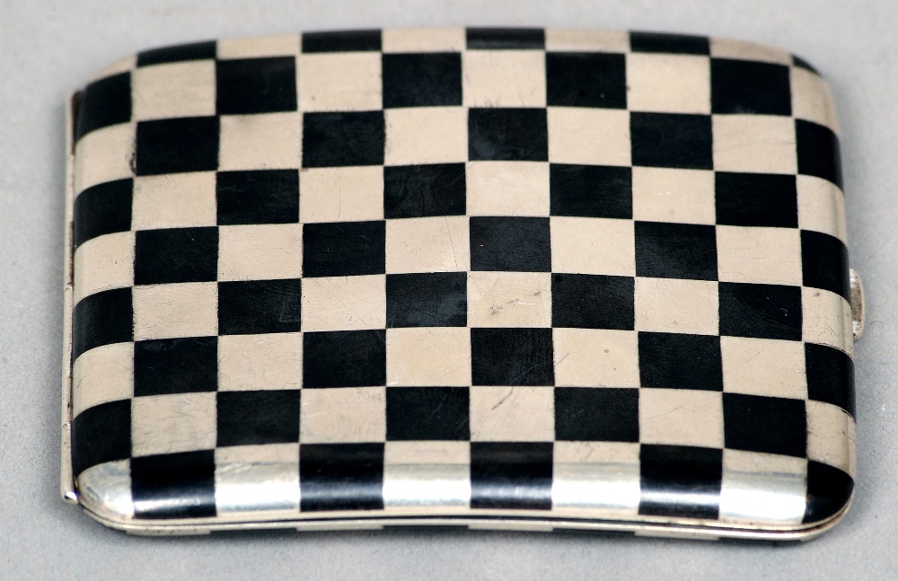 An unmarked Russian silver and niello cigarette case
Of flattened curved form with chequer board