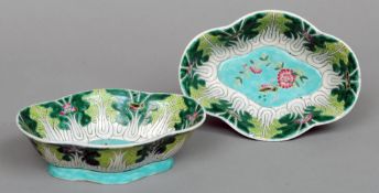 A pair of Chinese porcelain lobed dishes
Each decorated with insects amongst foliate and floral