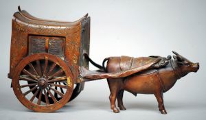 A 18th/19th century Chinese patinated bronze model of an oxen and carriage
With traces of original