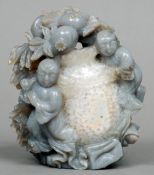 A Chinese carved agate figural group
Formed as two figures before an urn and fruiting bocage.  13