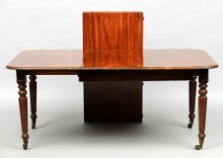 An early 19th century mahogany extending dining table
The moulded rounded rectangular top