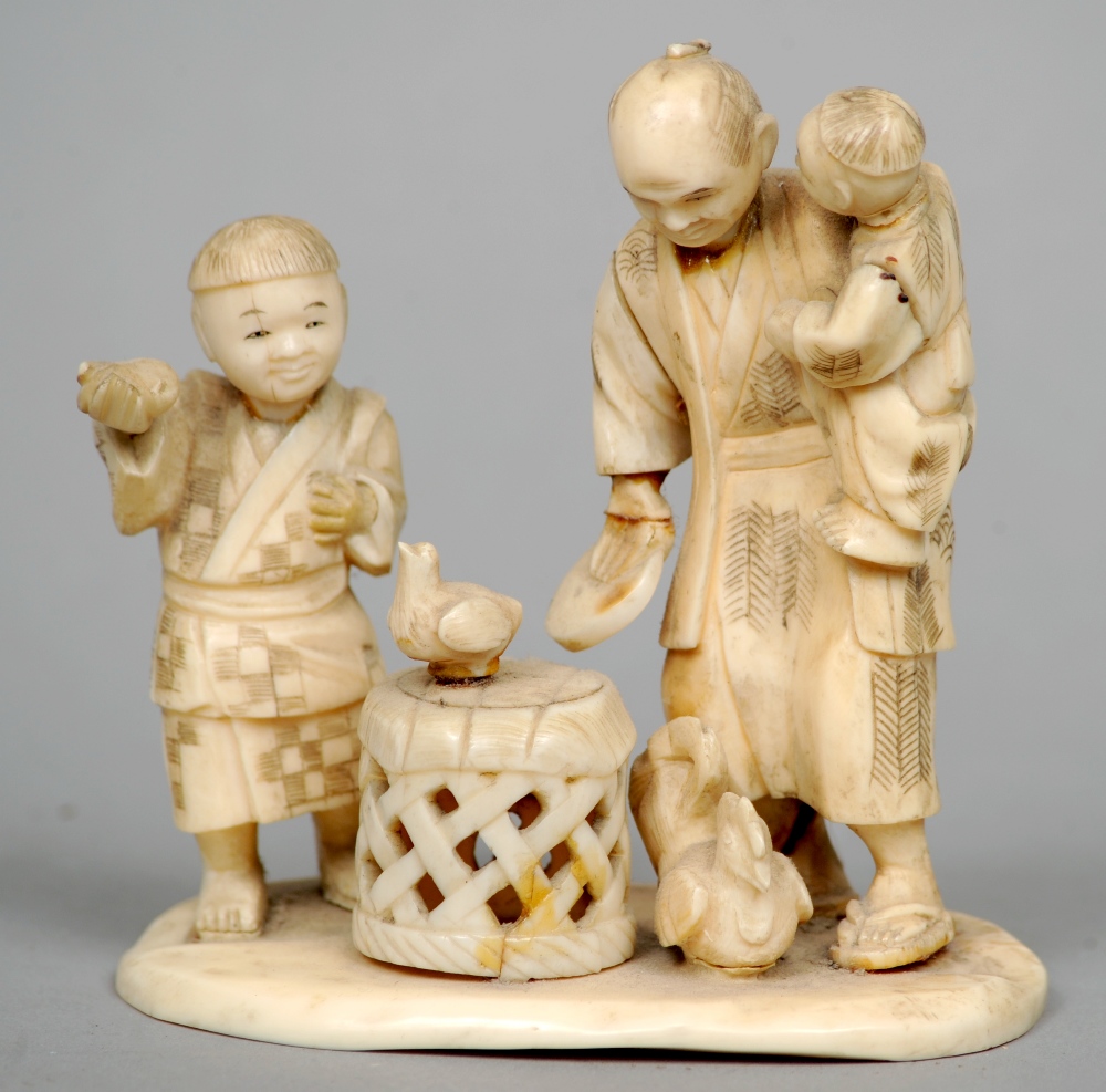 A 19th century Japanese ivory okimono
Formed as a figural group with chickens.  10 cms wide.
