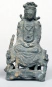 A Chinese archaistic bronzed figure
Modelled as a seated deity.  14 cms high.   CONDITION