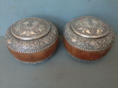 A fine pair of Sino-Tibetan turned wooden white metal mounted boxes and covers
Each band embossed