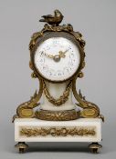 A 19th century gilt bronze mounted alabaster mantel clock
The circular enamel dial with Arabic