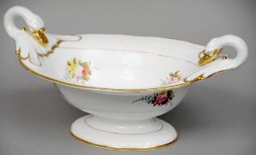 A 19th century porcelain twin handled tureen
Decorated with floral sprays within a moulded border,