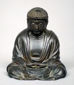 A small 19th century bronze model of Buddha
Typically modelled seated in the lotus position, the