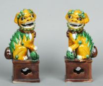 A pair of 19th century Chinese porcelain models of dogs-of-fo
Each typically modelled astride and