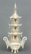 A Chinese carved ivory koro
The intricately carved pagoda form top above the main body carved with