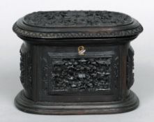 A late 19th century Cantonese carved hardwood jewellery box
The rounded rectangular hinged lid