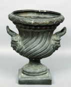A large bronze garden urn
With classical decoration.  80 cms high.   CONDITION REPORTS:  Some