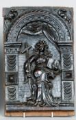 A 17th/18th century carved oak panel 
Depicting Justice holding a cross and a book.  39 cms