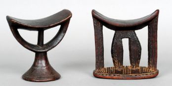 Two East African carved hardwood tribal head rests
Each of pierced and carved form with a typical
