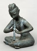 An Eastern, possibly Tibetan bronze model of a flutist
Seated cross legged playing a flute.  48