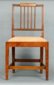 A set of six George III elm country chairs
Each with stepped top rail above splat backs and drop-