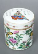 A 19th century Cantonese pot and cover
The removable lid decorated with a seated figure amongst