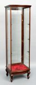 An early 20th century mahogany shop display cabinet
Of bow front form, standing on short cabriole