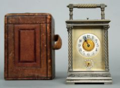 A 19th century silvered bronze Grande Sonnerie carriage alarm clock
The silvered dials flanked by