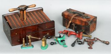 A quantity of gun and shooting related items
Including: various loaders and a mahogany loading tray.