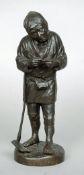 A 19th century Japanese bronze okimono
Formed as a farmer, standing with a pipe.  30 cms high.