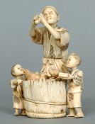 A 19th century Japanese carved ivory okimono
Carved as a farmer and his children collecting eggs.