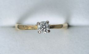 An 18 ct gold and platinum diamond solitaire ring
With central inset stone.   CONDITION REPORTS: