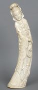 A large Chinese carved ivory figure of Guanyin
Modelled in flowing gowns holding a scroll and beads,