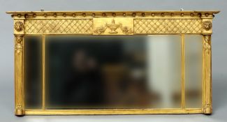 A Regency gilt painted triple glass overmantel mirror
The inverted ball mounted breakfront