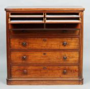 A Victorian mahogany gentleman's dressing chest
The rounded rectangular top above a dummy drawer/