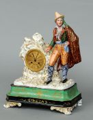 A 19th century Continental porcelain mantel clock
Formed as a brightly dressed young man leaning