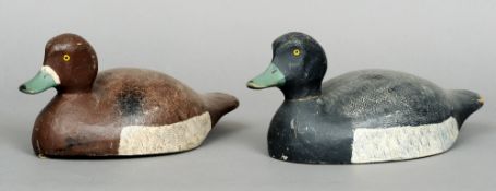 Two carved wooden decoy ducks
Each naturalistically painted.  The largest 35 cms long.  (2)