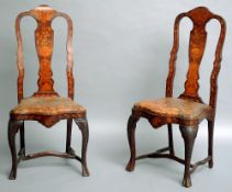 A set of eight 19th century Dutch marquetry inlaid mahogany dining chairs
Each central splat back