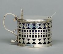 A Victorian silver mustard pot, hallmarked London 1893, maker's mark of Maurice Freeman
The hinged