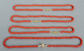 Four various unmarked yellow metal mounted coral necklaces
The largest 50 cms long.  (4)   CONDITION