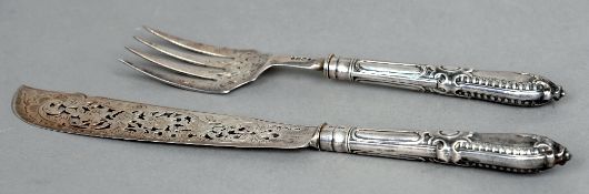 A pair of Victorian silver servers, each hallmarked London 1854, maker's mark of GA
With pierced and