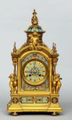 A 19th century French cloisonne decorated ormolu mantel clock
The pierced domed top above a seated